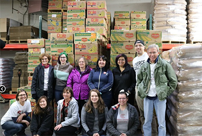 pierce employees and students volunteering at a food bank