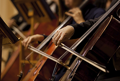 close up image of orchestra musicians at a concert