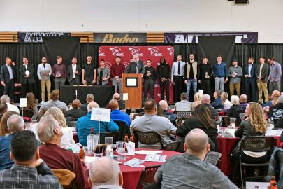 Pierce College baseball team stands at podium receiving award