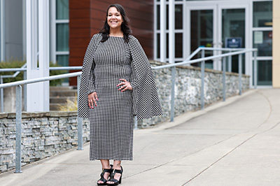 Alumna Shonteika Adeogun pictured in front of the Cascade building on the Pierce College Fort Steilacoom campus