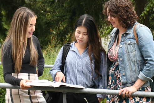 Students discussing at table
