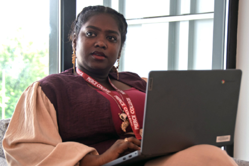 student sitting with laptop