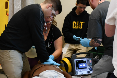 Students simulating resuscitation procedures