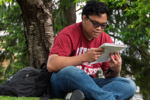 student studying outside