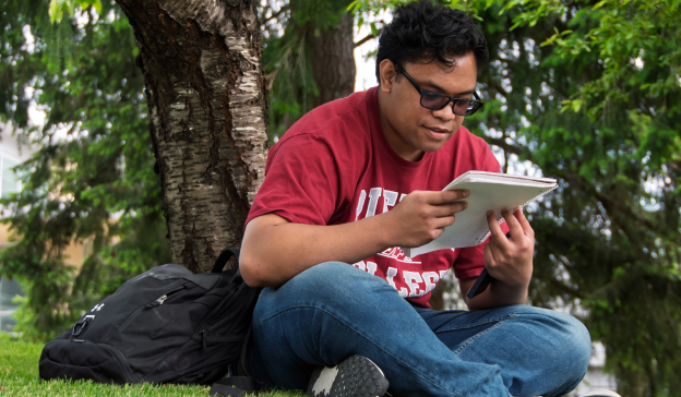 student studying outside