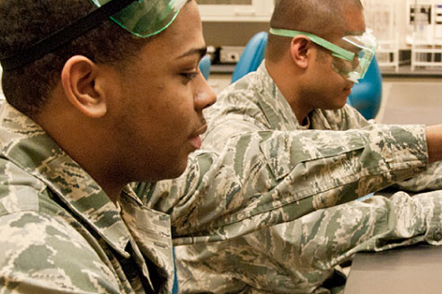 Military students engaged in a science class