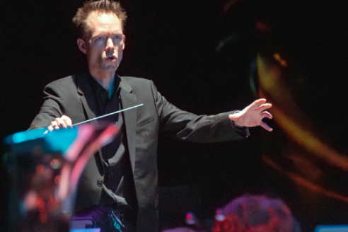 conductor in front of orchestra