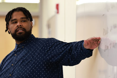 Professor teaching students in a classroom