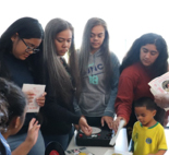 students at the welcome table for summer bridge program