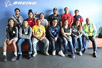 Group of students in front of Boeing logo