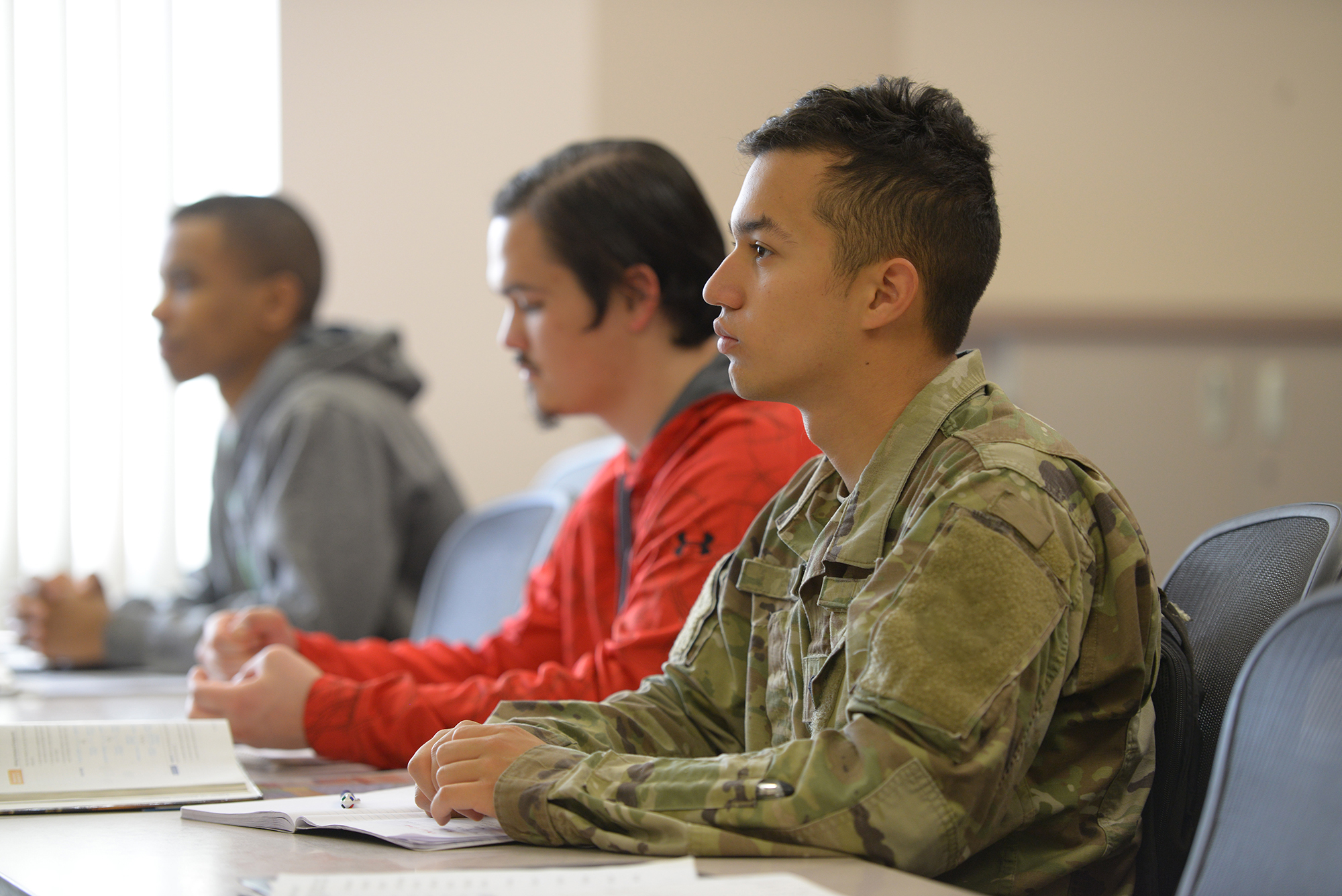 Military student studying in a classroom