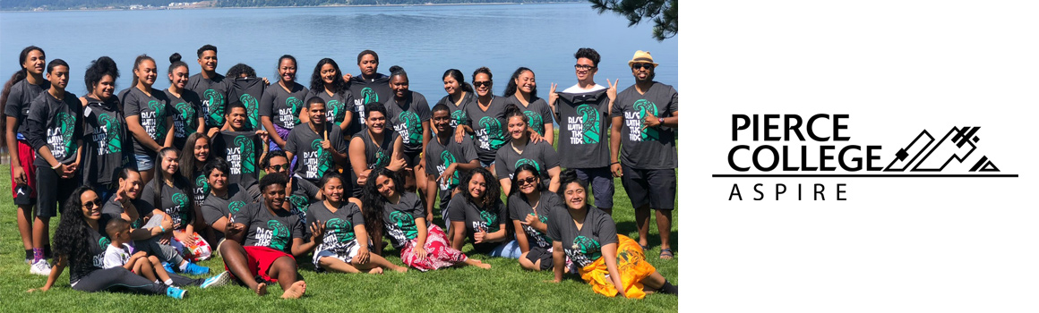 Group of students outside next to lake and ASPIRE logo