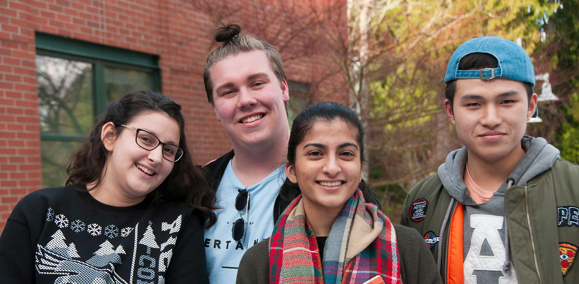 group of students smiling outdoors