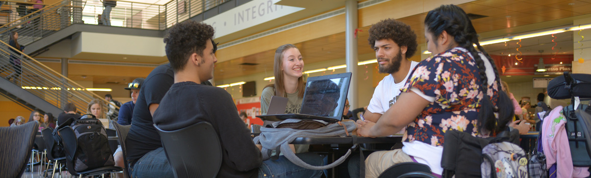 students studying at table in puyallup cafeteria