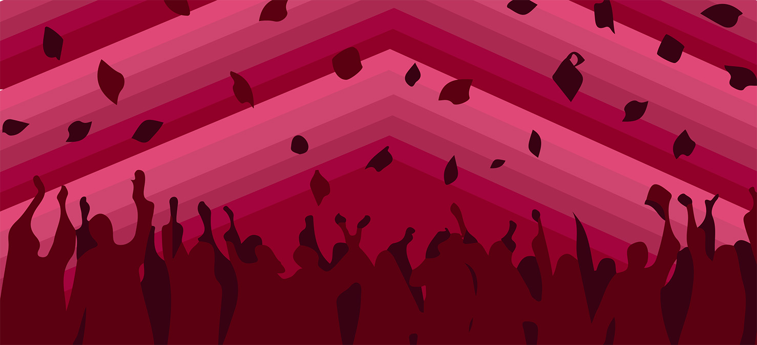 silhouettes of graduates in gowns tossing graduation caps