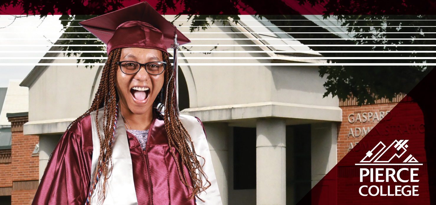 student in graduation cap and gown standing outside gaspard building