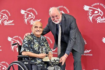 Director of Athletics Duncan Stevenson stands next to former Pierce College Campus Safety Officer retired Air Force Sgt. Ben Gomes, who was inducted into the Raider Athletics hall of fame on Jan. 20