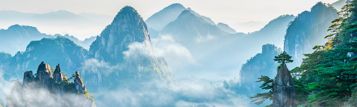 clouds in front of the mountains in huangshan china