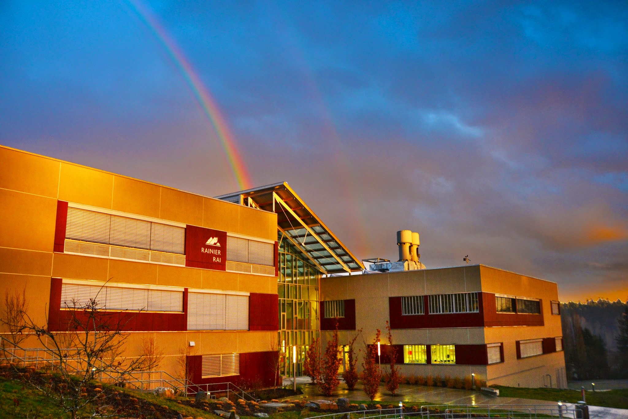 Rainier Building at sunset with rainbow