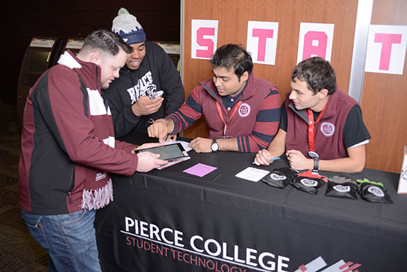 stat station stat team members helping students at a stat station