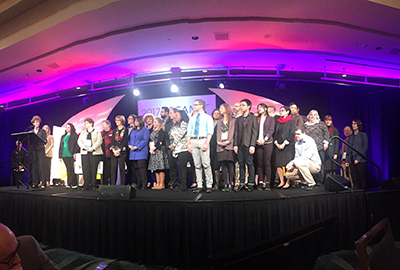 pierce college faculty and staff on stage accepting achieving the dream award