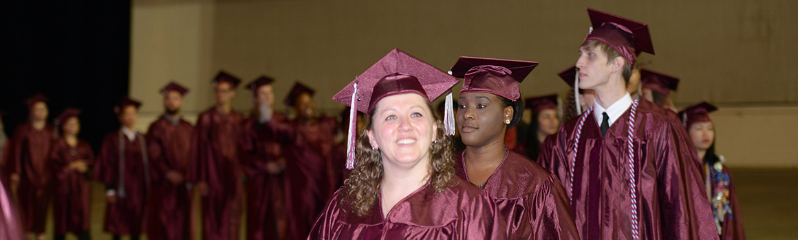 pierce college students in cap and gown waiting to enter commencement