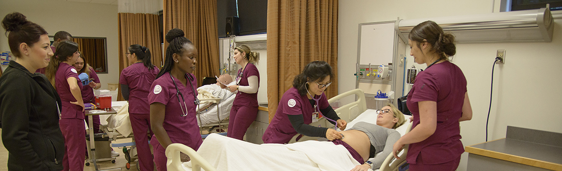 nursing students practicing treating a hospital patient