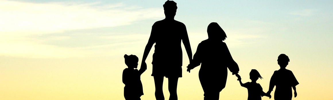 silhouette of family at sunset