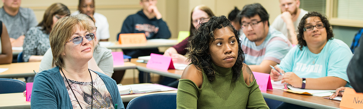 students in classroom listening to professor