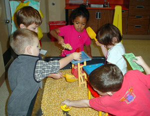 children playing with toys at table
