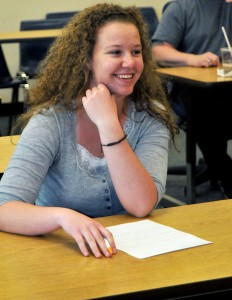 smiling student at desk