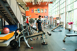 student in weight room in Puyallup health education center