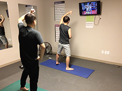 students exercising in residence hall fitness room students exercising in residence hall fitness room