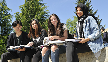 group of students looking at books