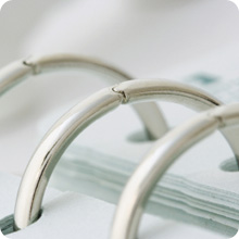close up of rings in a three-ring binder