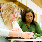 Two students studying at a table