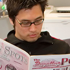 Student reading newspaper