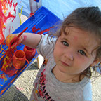 child finger painting