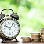 clock and stack of coins on a table