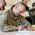 Military student happily studying Military student happily studying