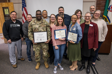 Pierce College at JBLM students, staff, and faculty pose at the 2024 Military Academic Achievement Awards Ceremony awards alongside Pierce Colege Chancellor and CEO Julie White.